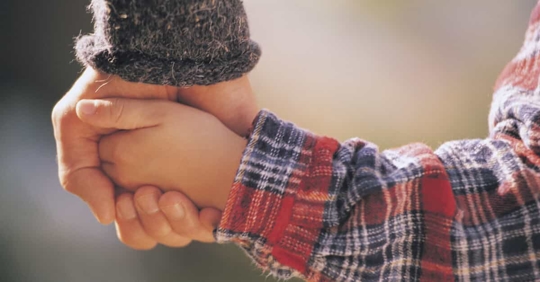 parent and child holding hand